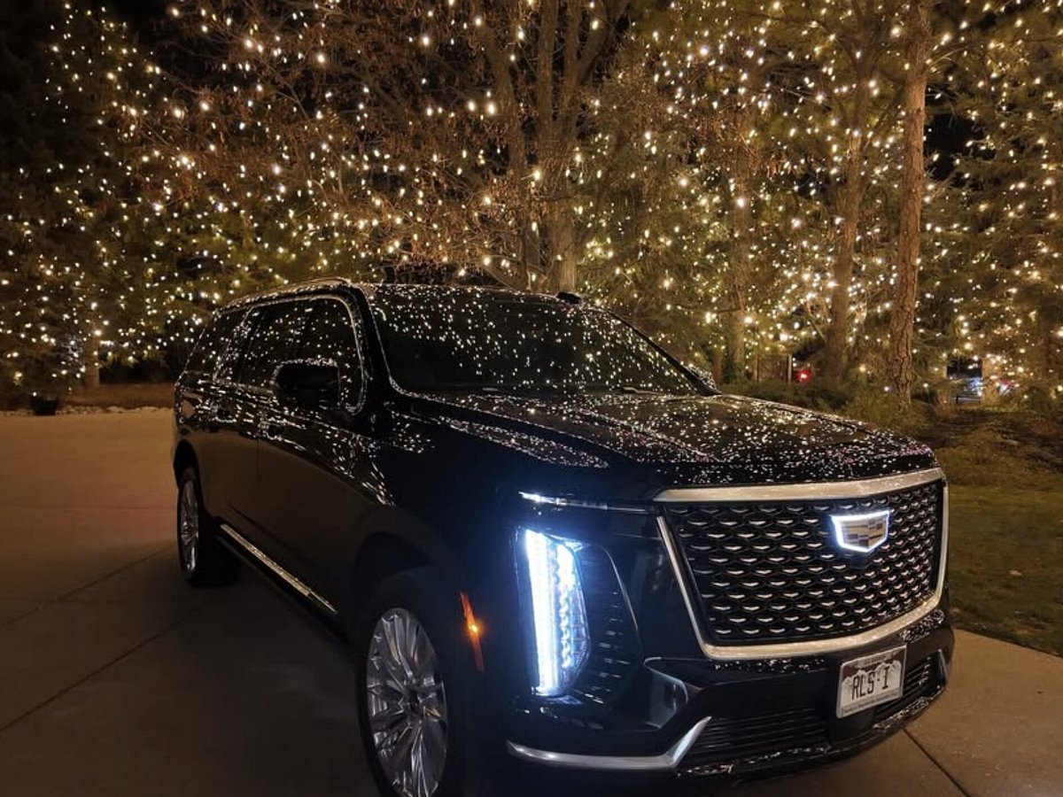 Luxury Cadillac SUV at night