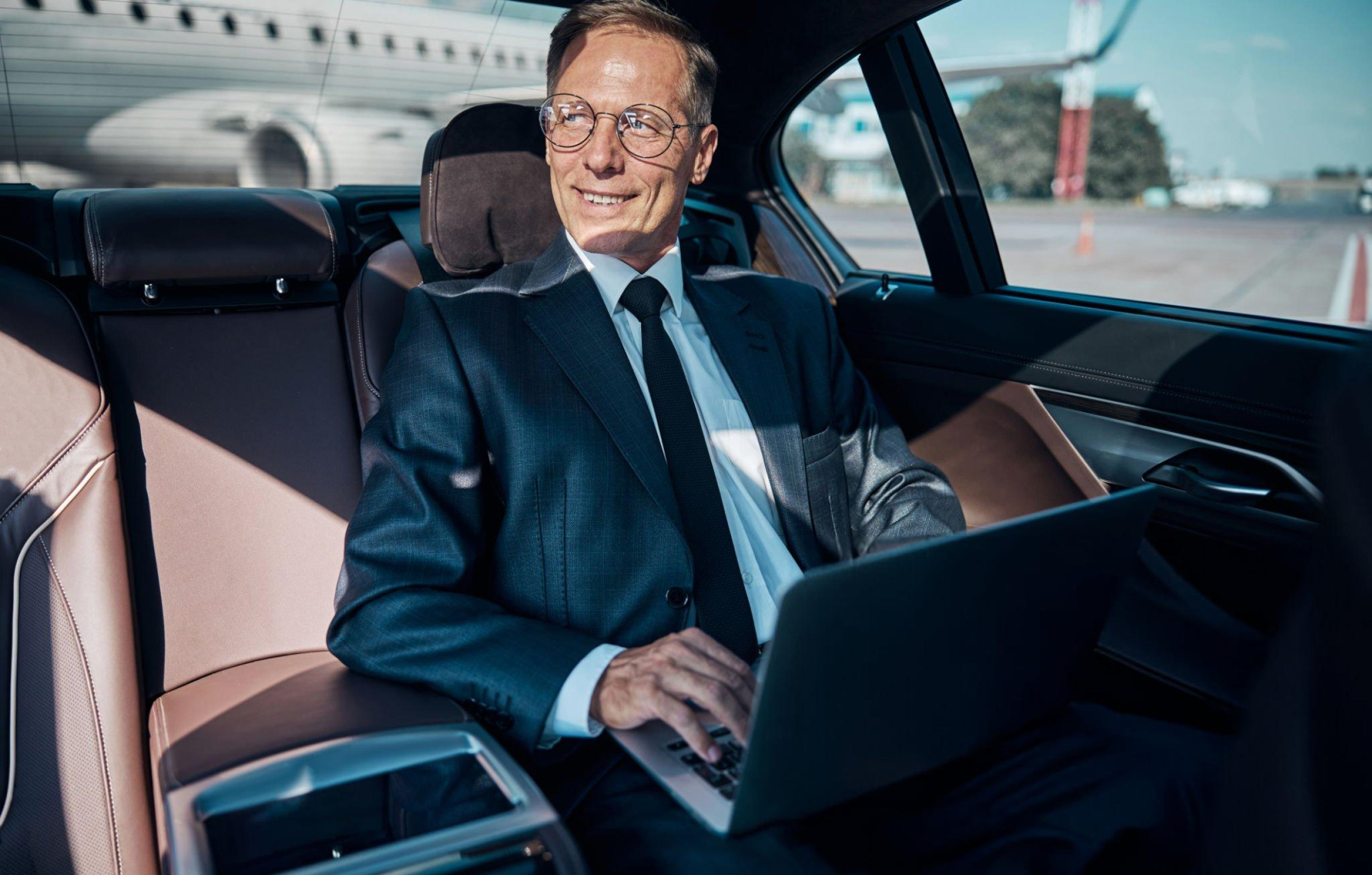 Executive passenger travelling in a luxury vehicle